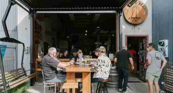 Group of people sitting outside at Rhyme and Reason Wanaka.jpg.650x425 q80 crop smart upscale